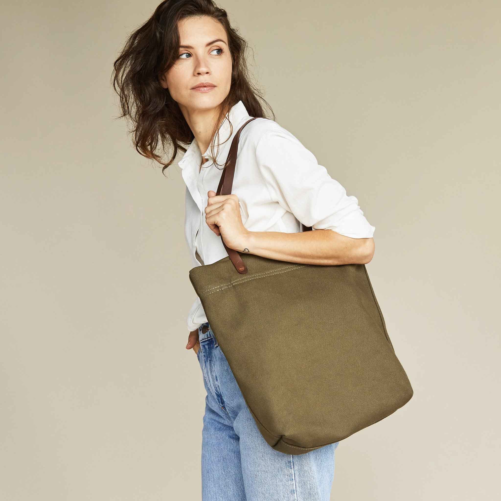 Image 1 of the Canvas Tote Olive Green on model