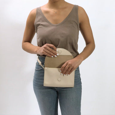 Video 1 of the Cleo Convertible Crossbody Rosewood shown on a model in motion