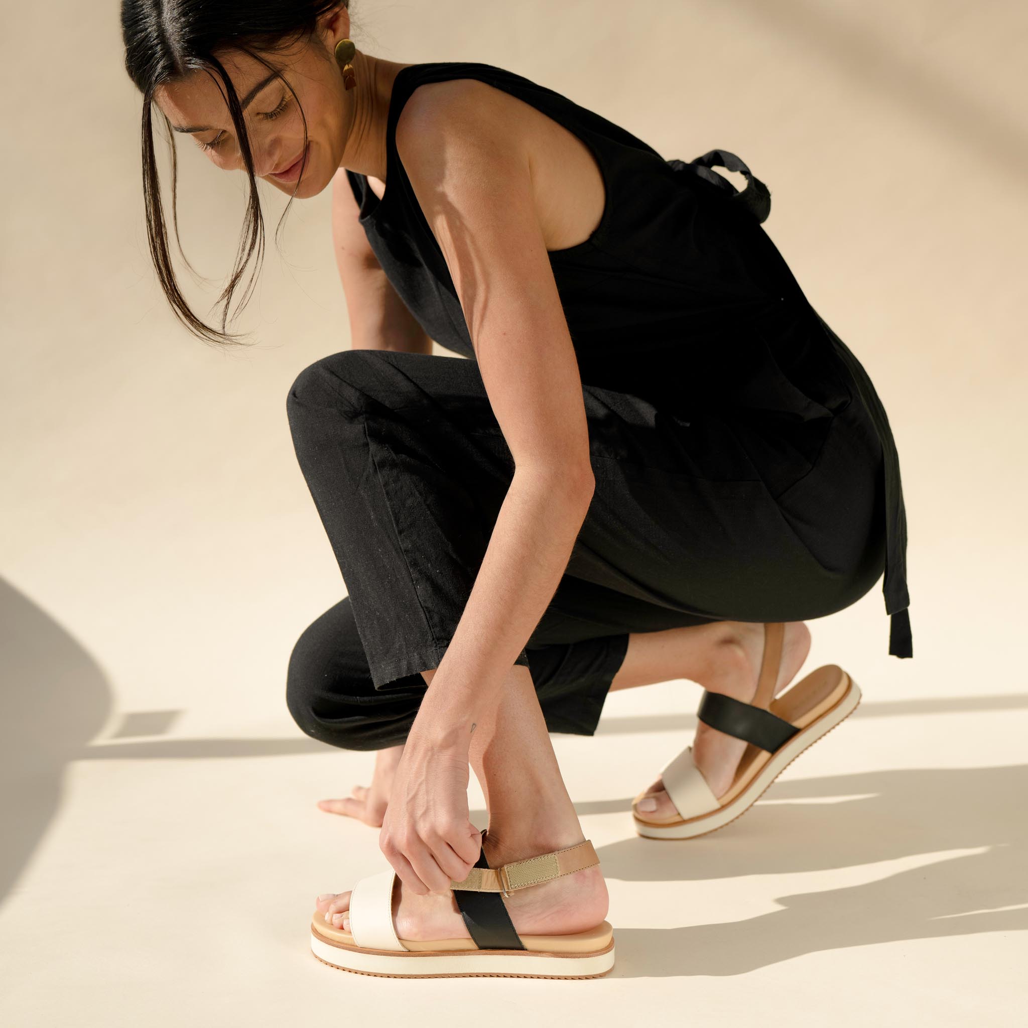Image 3 of the Go-To Flatform Sandal Bone/Black Colorblock on model 